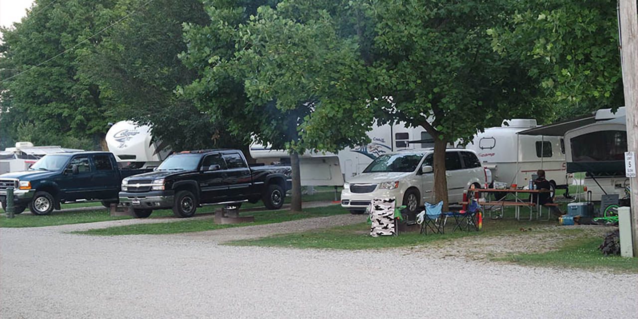 Family preparing RV and camping gear for the upcoming summer camping season