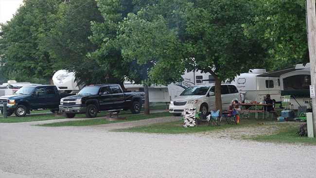 Family preparing RV and camping gear for the upcoming summer camping season