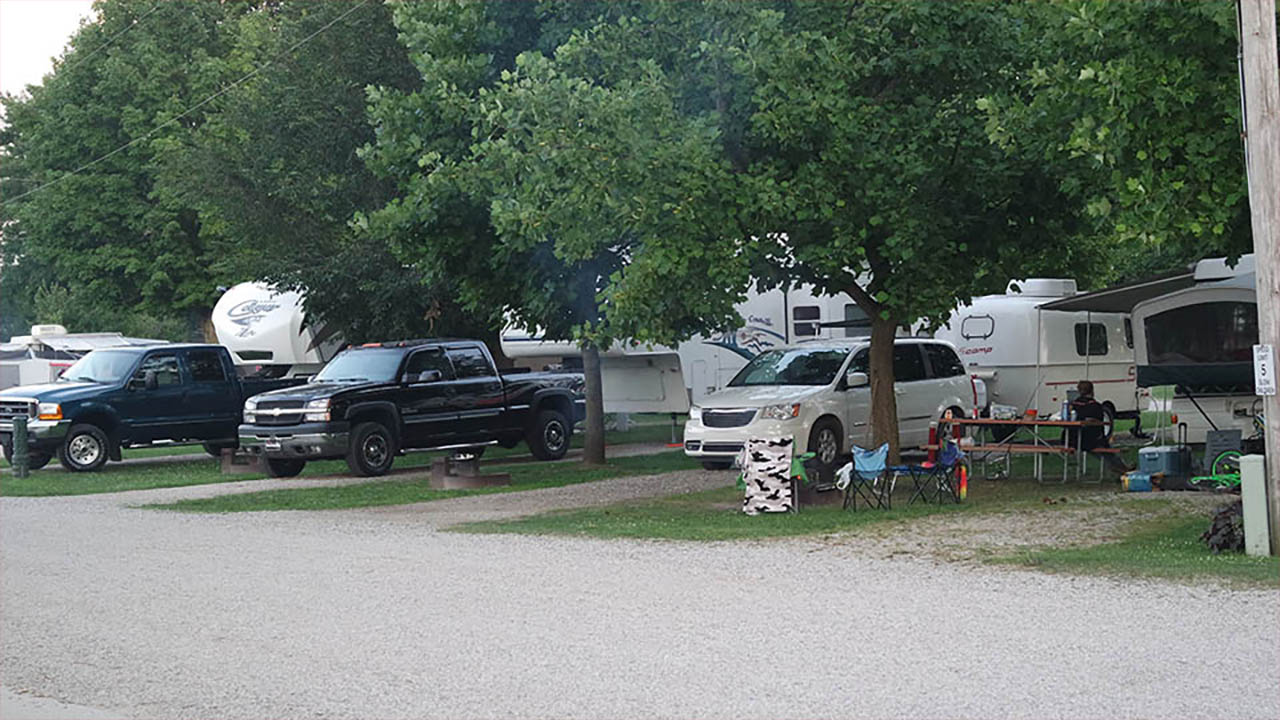 Family preparing RV and camping gear for the upcoming summer camping season